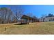 Expansive covered outdoor space adjoining a single-story home, offering ample room for entertainment and activities at 187 Bowden Rd, Ellenwood, GA 30294