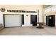 Garage features decorative signage, and attached door at 187 Bowden Rd, Ellenwood, GA 30294