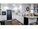 Well-designed kitchen featuring stainless steel appliances, granite counters, and ample counter space at 187 Bowden Rd, Ellenwood, GA 30294