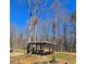 A well-constructed picnic shelter provides a shaded space for outdoor dining and recreation in a natural setting at 187 Bowden Rd, Ellenwood, GA 30294