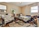 Bedroom boasts hardwood floors, natural light, and is furnished with a comfortable bed and chair at 1949 Capri Dr, Decatur, GA 30032