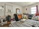 A bedroom featuring a bed, chair, dresser, and window at 1949 Capri Dr, Decatur, GA 30032