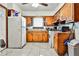 Functional kitchen featuring laminate floors, a refrigerator, and a gas range stove at 1949 Capri Dr, Decatur, GA 30032