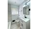 Bathroom featuring updated vanity with marble countertop and black hardware at 2403 Dawn Dr, Decatur, GA 30032