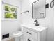Updated bathroom with marble countertop, black accents, and new fixtures at 2403 Dawn Dr, Decatur, GA 30032
