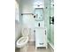 Updated bathroom with shower featuring glass doors, black hardware, and marble tiling at 2403 Dawn Dr, Decatur, GA 30032