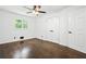 Bedroom with hardwood floors, ceiling fan and double door closet at 2403 Dawn Dr, Decatur, GA 30032