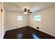 Bedroom featuring gleaming wood floors, a ceiling fan, and bright, natural light at 2403 Dawn Dr, Decatur, GA 30032