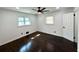 Bedroom featuring gleaming wood floors, a ceiling fan, and bright, natural light at 2403 Dawn Dr, Decatur, GA 30032