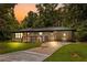 Charming brick home featuring a spacious carport and welcoming front porch at 2403 Dawn Dr, Decatur, GA 30032