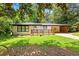 Inviting home with a charming front porch and well-manicured lawn at 2403 Dawn Dr, Decatur, GA 30032