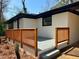 Cozy front porch featuring painted brick, a modern railing, and access to the home's entry at 2403 Dawn Dr, Decatur, GA 30032