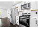 Modern kitchen featuring stainless steel appliances and white cabinets at 2403 Dawn Dr, Decatur, GA 30032
