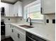 Bright kitchen with white cabinets, stainless steel appliances, and large sink at 2403 Dawn Dr, Decatur, GA 30032