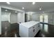Spacious kitchen island featuring quartz countertops, bright lighting and dark wood floors at 2403 Dawn Dr, Decatur, GA 30032