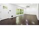 Bright living room featuring hardwood floors, a large window, and ample space at 2403 Dawn Dr, Decatur, GA 30032
