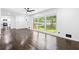 Inviting living room with hardwood floors and a large window offering natural light at 2403 Dawn Dr, Decatur, GA 30032