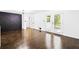 Bright and airy living room with hardwood floors, a decorative wall, and access to the outside at 2403 Dawn Dr, Decatur, GA 30032