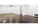 Expansive living room with beautiful hardwood floors and bright, white walls at 2403 Dawn Dr, Decatur, GA 30032