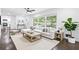 Stylish living room with modern decor, hardwood floors and natural lighting at 2403 Dawn Dr, Decatur, GA 30032