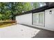 Spacious patio with white brick siding and a black accent trim on the roof at 2403 Dawn Dr, Decatur, GA 30032