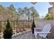 Private balcony area with seating, overlooking trees and parking at 300 Johnson Ferry Ne Rd # A313, Atlanta, GA 30328