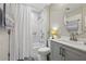 Bright bathroom with a white marble shower, a vanity, and a modern round mirror at 300 Johnson Ferry Ne Rd # A313, Atlanta, GA 30328