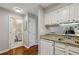 Convenient kitchen space with granite counters adjacent to bath and living area at 300 Johnson Ferry Ne Rd # A313, Atlanta, GA 30328