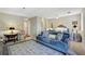 Spacious living room features a comfortable blue sofa, plush carpet, and stylish decor at 300 Johnson Ferry Ne Rd # A313, Atlanta, GA 30328