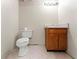 Basement bathroom with standard toilet and sink with storage at 370 Burton Dr, Douglasville, GA 30134