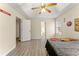 Bright bedroom with tray ceiling, natural light, and wood-look flooring at 370 Burton Dr, Douglasville, GA 30134