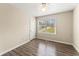 Spare bedroom featuring wood-look floors and one bright window at 370 Burton Dr, Douglasville, GA 30134