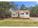 Lovely home with well-manicured lawn, surrounded by mature trees at 370 Burton Dr, Douglasville, GA 30134