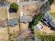A high aerial shot of a home with mature trees, a backyard, and surrounding neighborhood at 1421 Downs Sw Dr, Atlanta, GA 30311