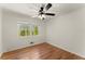 Bright bedroom with hardwood floors and large window at 1421 Downs Sw Dr, Atlanta, GA 30311
