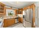 Modern kitchen featuring stainless steel appliances and granite countertops at 1421 Downs Sw Dr, Atlanta, GA 30311