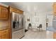 Bright kitchen with stainless steel refrigerator and a cozy dining area at 1421 Downs Sw Dr, Atlanta, GA 30311
