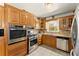 Well-equipped kitchen featuring stainless steel appliances and granite countertops at 1421 Downs Sw Dr, Atlanta, GA 30311