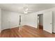 Spacious main bedroom offering hardwood floors, closet space and access to an ensuite bathroom at 1421 Downs Sw Dr, Atlanta, GA 30311
