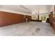 This covered patio features brick columns, a concrete floor, and ample open space at 1421 Downs Sw Dr, Atlanta, GA 30311
