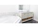Luxurious bathroom featuring a soaking tub, double sinks, marble countertops, and elegant fixtures at 4541 Wieuca Ne Rd, Atlanta, GA 30342
