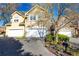 Charming two-story home featuring a two-car garage and beautifully landscaped front yard with mature tree at 4541 Wieuca Ne Rd, Atlanta, GA 30342