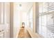 Bright hallway with hardwood floors and natural light streaming through the window at 4541 Wieuca Ne Rd, Atlanta, GA 30342