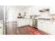 White kitchen features white cabinets, stainless steel appliances, and plenty of natural light at 4541 Wieuca Ne Rd, Atlanta, GA 30342