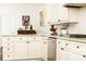 Tastefully designed white kitchen features stainless steel appliances and modern finishes at 4541 Wieuca Ne Rd, Atlanta, GA 30342