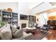 Comfortable living room with fireplace, built-in bookshelves, and stylish contemporary furniture at 4541 Wieuca Ne Rd, Atlanta, GA 30342