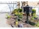Charming black mailbox set amidst a colorful array of flowers and plants, enhancing curb appeal at 4541 Wieuca Ne Rd, Atlanta, GA 30342
