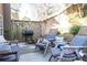 Cozy patio featuring comfortable seating, a grill, and a wooden fence for added privacy at 4541 Wieuca Ne Rd, Atlanta, GA 30342