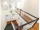 Grand foyer featuring a hardwood staircase with contrasting black railings and views of the front entrance at 4541 Wieuca Ne Rd, Atlanta, GA 30342