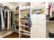 Spacious walk-in closet with custom shelving, hardwood floors, and ample storage for clothing and accessories at 4541 Wieuca Ne Rd, Atlanta, GA 30342